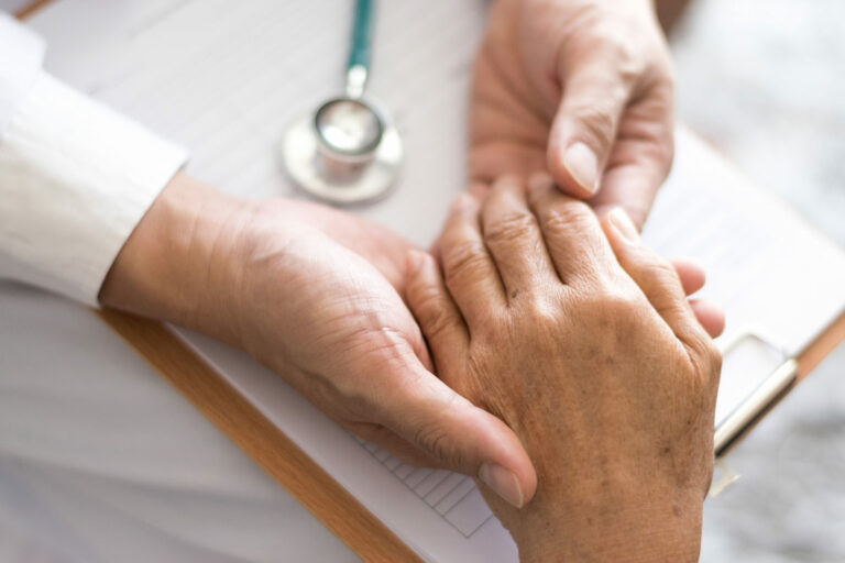 Proveer at Northgate | Healthcare professional holding senior's hand